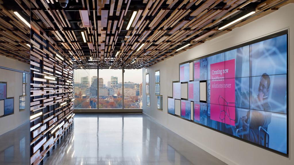 Inside a J&J building looking out at a city skyline