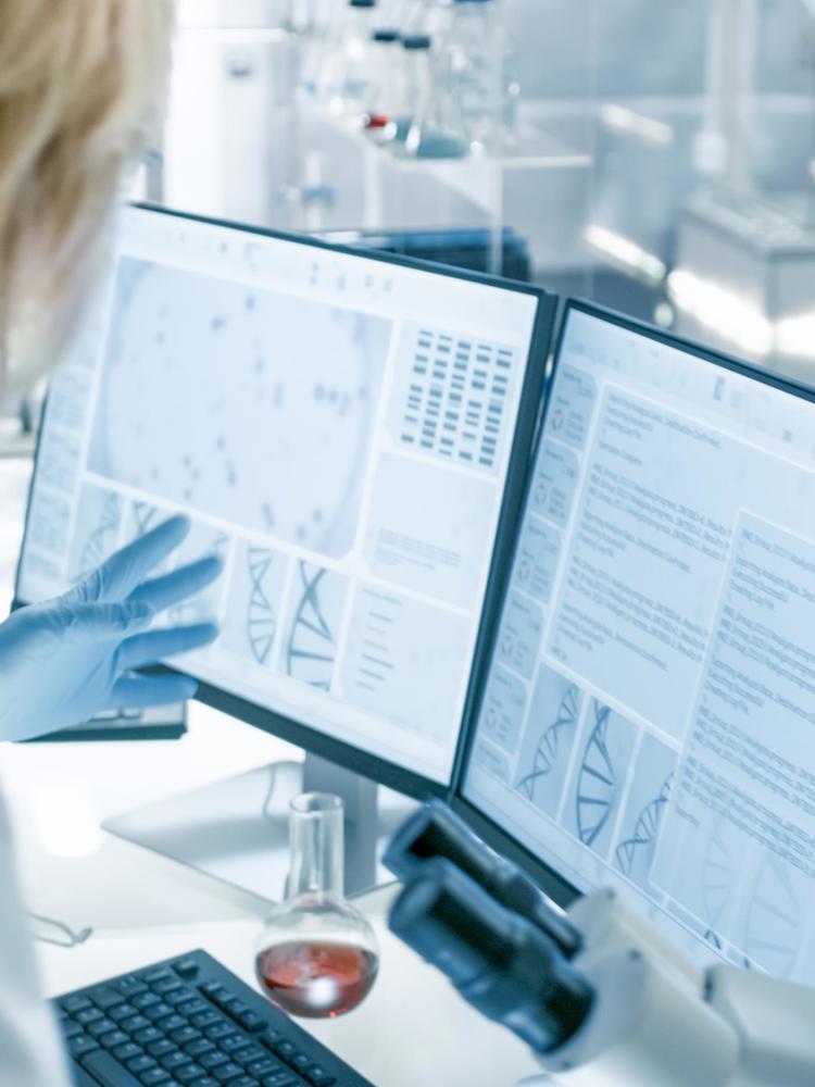 JJ Photo Female Scientist Discussing Scientific Data With Assistant Shutterstock 1073659382