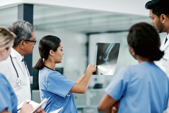 A team of leading healthcare providers consults on a diagnosis